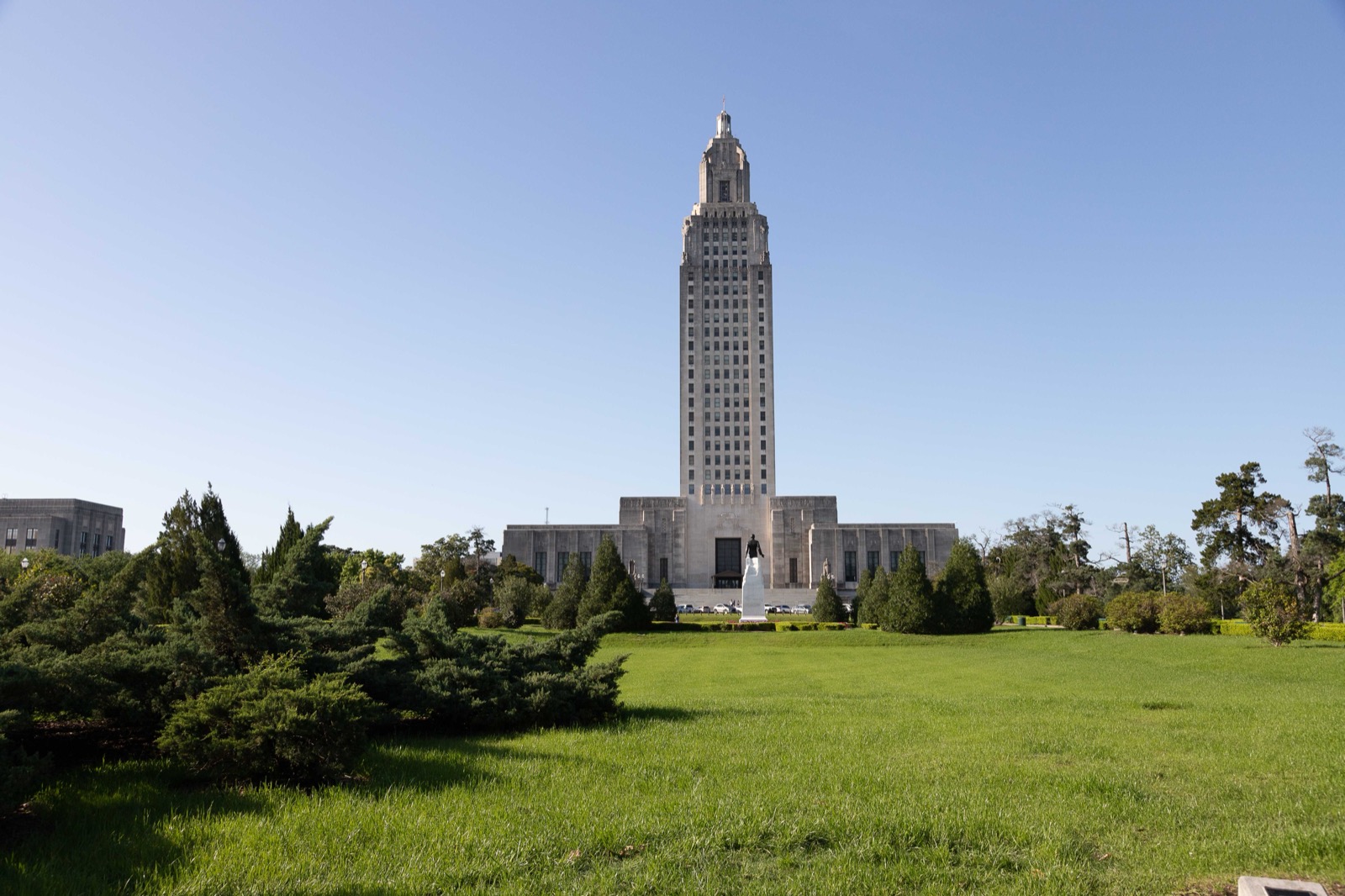 The Louisiana State Capitol building rising over the lawn — backdrop for the LA DOTD partnership