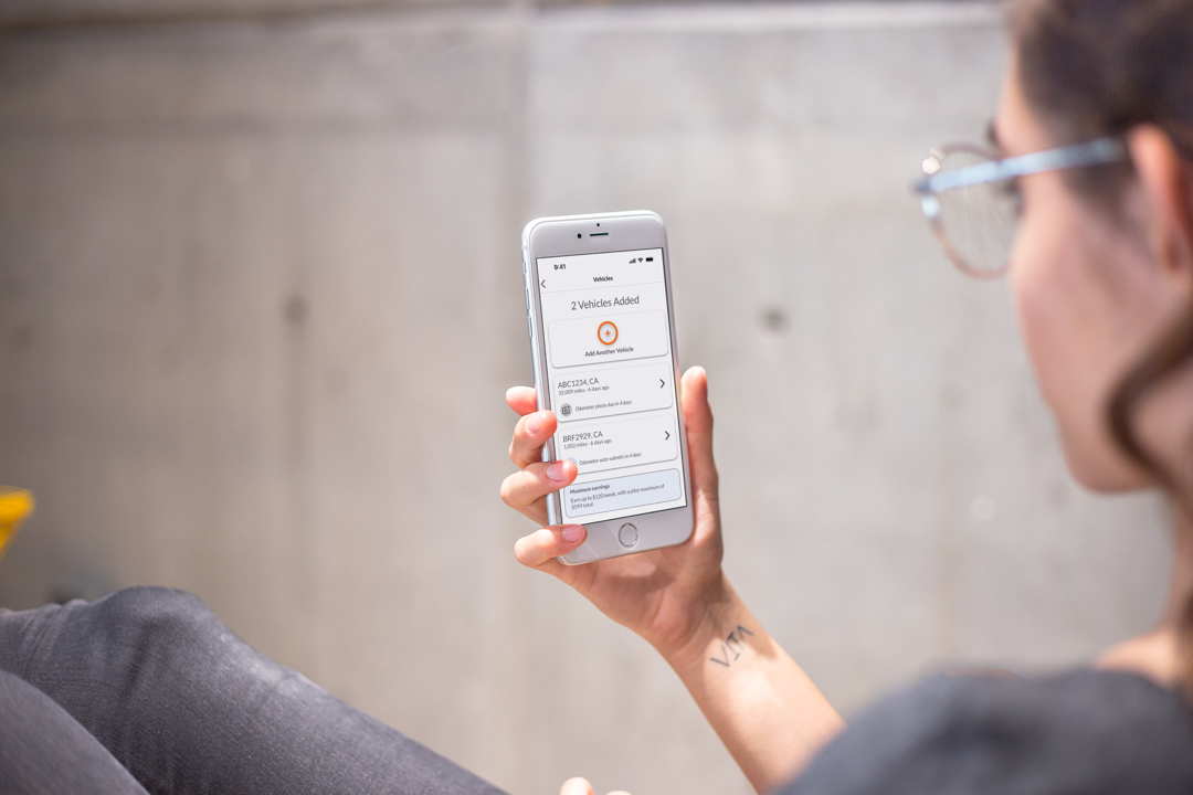 One Car Challenge app — held in hand, weekly mileage