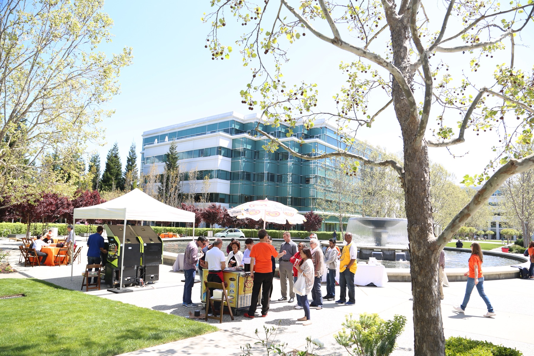 On-campus outreach event at Bishop Ranch — tables, umbrellas, employees gathered